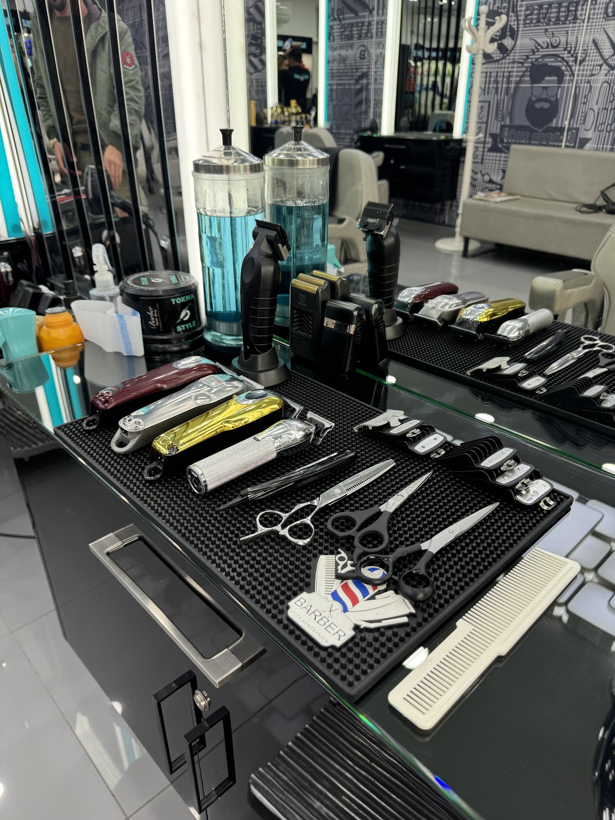 Clippers, scissors and tools laid out at a station